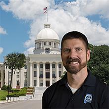 Photo of Mike Trice with Alabama state capitol in background
