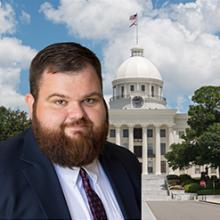 Photo of Tyler Carr with Alabama state capitol in background