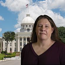 Photo of Teresa Hope with Alabama state capitol in background