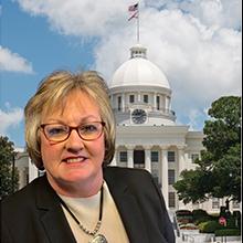 Head shot of Debra Wallace wtih Alabama Capitol Building in background