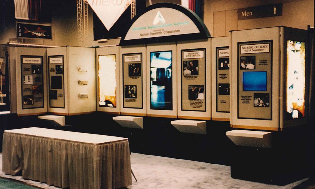 Large Alabama Supercomputer Authority booth with the ASA logo and several graphical an photographical displays at the Supercomputing Conference