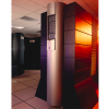 ASA's tall, dark gray Cray C90 supercomputer tower with a prominent silver vertical pillar in the foreground, with the older Cray X-MP system visible in the server room background