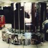 Two men working on installing the Cray XMP on datacenter floor exposing internal components